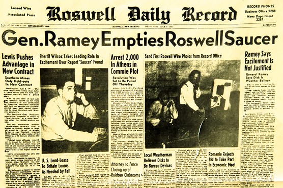 Newspaper front page with headline 'Gen. Ramey Empties Roswell Saucer'