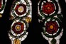 York Minster's rose window features 16th-century Tudor Roses white on red (left) and Lancastrian Roses, red