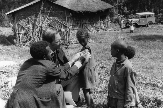 Dr DA Henderson examines children’s smallpox vaccination scars in Ethiopia