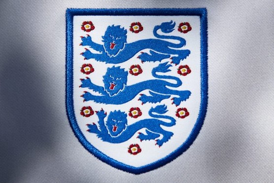 The England football team badge, showing three lions on a field of ten Tudor roses