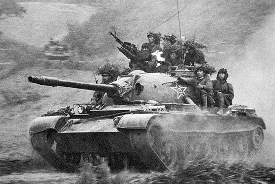 A Chinese tank nears the city of Lang Son in Vietnam, 1979 and (right) Chinese and Vietnamese ministers meet for talks, 1991. Rana Mitter highlights the role of diplomacy in bringing war between Vietnam and China to an end.