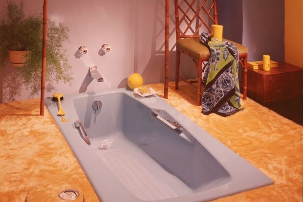 A view of a bathroom interior showing a sunken blue tub and wall to wall yellow shag carpeting. (Photo by Getty Images) A view of a bathroom interior showing a sunken blue tub and wall to wall yellow shag carpeting. (Photo by Getty Images)