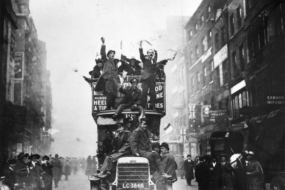 London crowds celebrating the signing of the armistice at the end of the First World War.