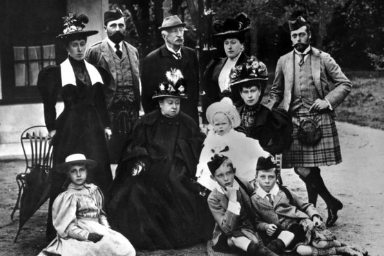 c1895: Queen Victoria with her family. Standing left to right: Princess Helena Victoria of Schleswig-Holstein; Prince Henry of Battenberg; Count Arthur Mensdorff-Pouilly; Beatrice, Princess Henry of Battenberg; George, Duke of York. Seated left to right: Princess Victoria Eugenie of Battenberg; Queen Victoria; Victoria Mary, Duchess of York holding Prince Edward of York; Prince Arthur of Connaught; and Prince Alexander of Battenberg. (Photo by Hulton Archive/Getty Images)