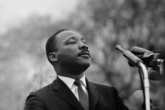 Dr Martin Luther King Jr speaking before crowd of 25,000 Selma To Montgomery, Alabama civil rights marchers, in front of Montgomery, Alabama state capital building.
