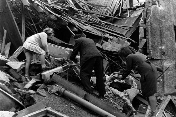 Survivors of the London blitz. Survivors of the London blitz searching in the ruins of bombed houses.