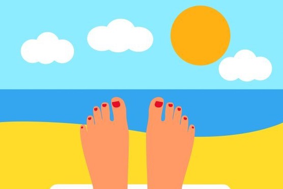 A cartoon image of feet in front of the sea