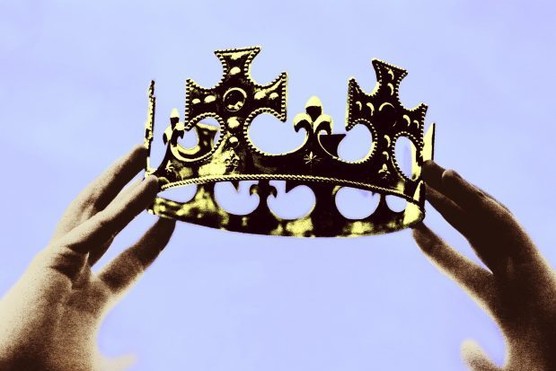 Hands holding up crown