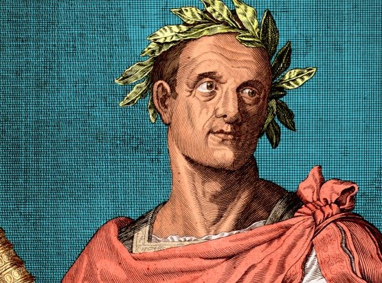 A colourised depiction of Julius Caesar wearing a laurel wreath and an armour.