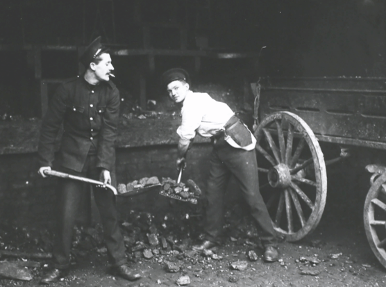 Soldiers drafted in to work during a coal porters’ strike in London, shovelling coal