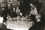 An Edwardian family seated at a dinner table
